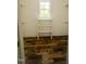 Walk-in closet with shelves and a window showcasing an organized and functional storage space at 201 Lexington Park Dr, Oxford, NC 27565