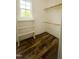 Bright closet features custom wood flooring, wood trim, and functional shelving perfect for organization at 201 Lexington Park Dr, Oxford, NC 27565