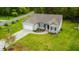 Charming home with gray siding, manicured lawn, and a convenient two-car garage and driveway at 201 Lexington Park Dr, Oxford, NC 27565