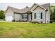 Attractive single-Gathering home showcasing manicured lawn, an attached garage, and tasteful landscaping at 201 Lexington Park Dr, Oxford, NC 27565
