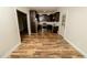 View of kitchen and dining area featuring a range of stainless steel appliances and wooden floor at 201 Lexington Park Dr, Oxford, NC 27565