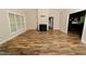 Bright living room featuring hardwood floors, a fireplace, and lots of natural light at 201 Lexington Park Dr, Oxford, NC 27565