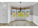 Cozy breakfast nook with large windows offering a view of the front yard at 201 Wendy Pl, Benson, NC 27504