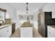 Open kitchen with stainless appliances, granite counters, and an adjacent dining area at 201 Wendy Pl, Benson, NC 27504