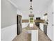 Open kitchen with island, stainless appliances, tile backsplash, and modern lighting at 201 Wendy Pl, Benson, NC 27504