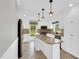 Modern kitchen with stainless steel appliances, island with granite counters, and ample cabinet space at 201 Wendy Pl, Benson, NC 27504