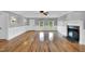 Bright living room with hardwood floors, fireplace and ceiling fan at 201 Wendy Pl, Benson, NC 27504
