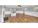 Hardwood floors in the living room with fireplace and ceiling fan at 201 Wendy Pl, Benson, NC 27504