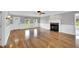 Bright living room with hardwood floors, a fireplace, and light gray walls at 201 Wendy Pl, Benson, NC 27504