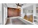 Bright sunroom with tile floor, exposed brick wall, and built-in shelving at 201 Wendy Pl, Benson, NC 27504