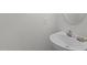 Clean and simple half bathroom featuring a sleek sink and vanity at 206 Black Bird Ct, Cary, NC 27511