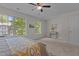 Spacious bedroom with plenty of natural light, neutral decor, and comfortable furnishings at 206 Black Bird Ct, Cary, NC 27511