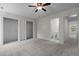 Spacious bedroom boasts neutral walls, soft carpet, ceiling fan, and access to an ensuite bathroom at 206 Black Bird Ct, Cary, NC 27511
