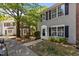 Two story townhouse, vinyl siding, black shutters, and inviting landscaping at 206 Black Bird Ct, Cary, NC 27511