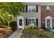 Inviting two-story townhome with classic architectural details and a neatly landscaped yard at 206 Black Bird Ct, Cary, NC 27511