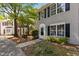 Two story townhouse, vinyl siding, black shutters, and inviting landscaping at 206 Black Bird Ct, Cary, NC 27511