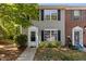 Charming two-story home with vinyl siding, black shutters, and a well-maintained front yard at 206 Black Bird Ct, Cary, NC 27511