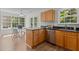 Open kitchen and dining area with stainless steel appliances, granite countertops, and bright natural light at 206 Black Bird Ct, Cary, NC 27511
