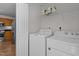 Convenient laundry room equipped with a washer, dryer, and shelving for storage at 206 Black Bird Ct, Cary, NC 27511