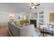 Bright living room with hardwood floors, a fireplace, built-in shelves, and comfortable seating at 206 Black Bird Ct, Cary, NC 27511