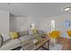 Comfortable living room with a sectional sofa, hardwood floors, and natural lighting at 206 Black Bird Ct, Cary, NC 27511