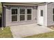 Charming back patio with three windows and a door, perfect for enjoying outdoor living at 2221 Holtwood Way, Apex, NC 27523