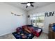 bedroom featuring a car-shaped bed, ceiling fan and natural light streaming through a large window at 2221 Holtwood Way, Apex, NC 27523