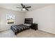 Cozy bedroom with ceiling fan, natural light, and comfortable setting at 2221 Holtwood Way, Apex, NC 27523