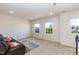 Inviting bonus room offering large windows, carpeted floors, and cozy seating area, perfect for entertaining at 2221 Holtwood Way, Apex, NC 27523