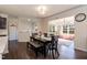 Inviting dining room with decorative wood table, plush seating, and chandelier lighting at 2221 Holtwood Way, Apex, NC 27523