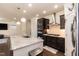 Modern kitchen featuring stainless steel appliances, a granite island with seating, and ample cabinet space at 2221 Holtwood Way, Apex, NC 27523