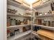 Walk-in pantry with organized shelving, ample storage space for food and household items at 2221 Holtwood Way, Apex, NC 27523