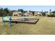 Community playground with swing set and piano decoration amid well-maintained lawns and single Gathering homes at 2221 Holtwood Way, Apex, NC 27523