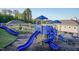 Community playground featuring multiple slides, climbing structures, and covered picnic area at 2221 Holtwood Way, Apex, NC 27523