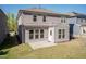 Rear of home highlighting the siding, windows, and patio with an expansive backyard at 2221 Holtwood Way, Apex, NC 27523
