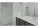 Bathroom with double sinks, modern fixtures, vanity and shower over tub at 2227 Rocky Bay Ct, Cary, NC 27519