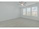 Bedroom with light-colored carpet, white walls and ceiling fan at 2227 Rocky Bay Ct, Cary, NC 27519