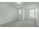 Spacious bedroom features plush carpeting, neutral walls, and plenty of natural light from the windows at 2227 Rocky Bay Ct, Cary, NC 27519