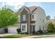 Inviting two-story home featuring brick and siding accents, a well-manicured lawn, and a charming front yard at 2227 Rocky Bay Ct, Cary, NC 27519