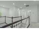 White walls, carpet and trim in this hallway with access to a bathroom and other rooms at 2227 Rocky Bay Ct, Cary, NC 27519