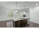Updated kitchen with stainless steel appliances and a spacious breakfast bar at 2227 Rocky Bay Ct, Cary, NC 27519