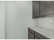 This kitchen features lovely granite countertops and dark wood cabinets at 2227 Rocky Bay Ct, Cary, NC 27519