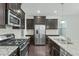 Updated kitchen featuring stainless steel appliances and granite countertops at 2227 Rocky Bay Ct, Cary, NC 27519