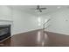 Open living room with hardwood floors and gas fireplace at 2227 Rocky Bay Ct, Cary, NC 27519