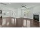 Bright living room with hardwood floors, fireplace, and a ceiling fan at 2227 Rocky Bay Ct, Cary, NC 27519