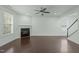 Open living room with hardwood floors and fireplace at 2227 Rocky Bay Ct, Cary, NC 27519