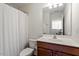 Bathroom showing a single sink vanity, toilet, and shower at 225 Mayfield Dr, Apex, NC 27539