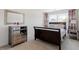 Bedroom features a bed, two dressers, and neutral decor at 225 Mayfield Dr, Apex, NC 27539