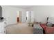 Bedroom featuring a sitting area, neutral carpeting, and lots of natural light at 225 Mayfield Dr, Apex, NC 27539
