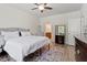 Bedroom showcasing a bed, dresser, mirror and decorative rug at 225 Mayfield Dr, Apex, NC 27539